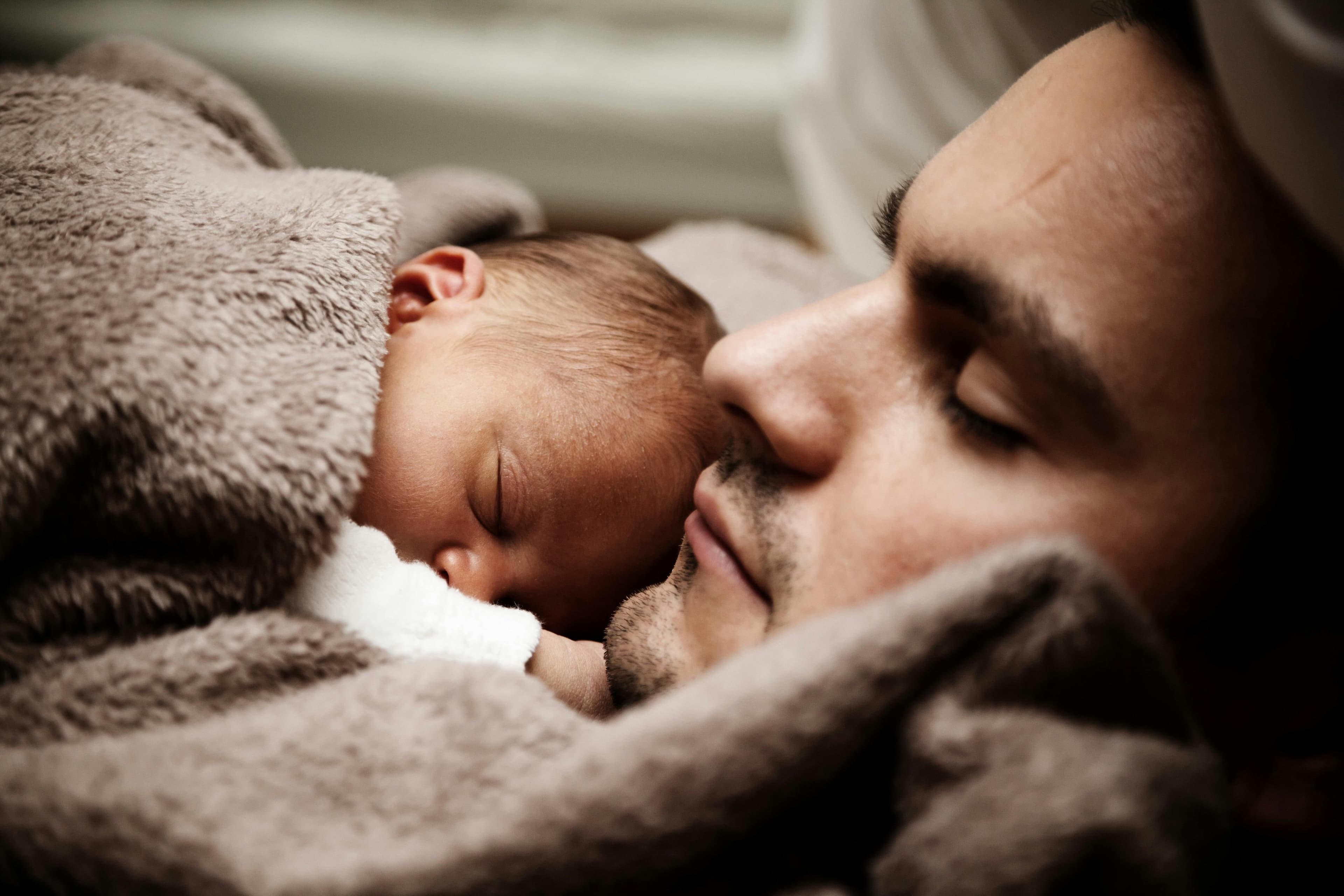A father holding his newborn child